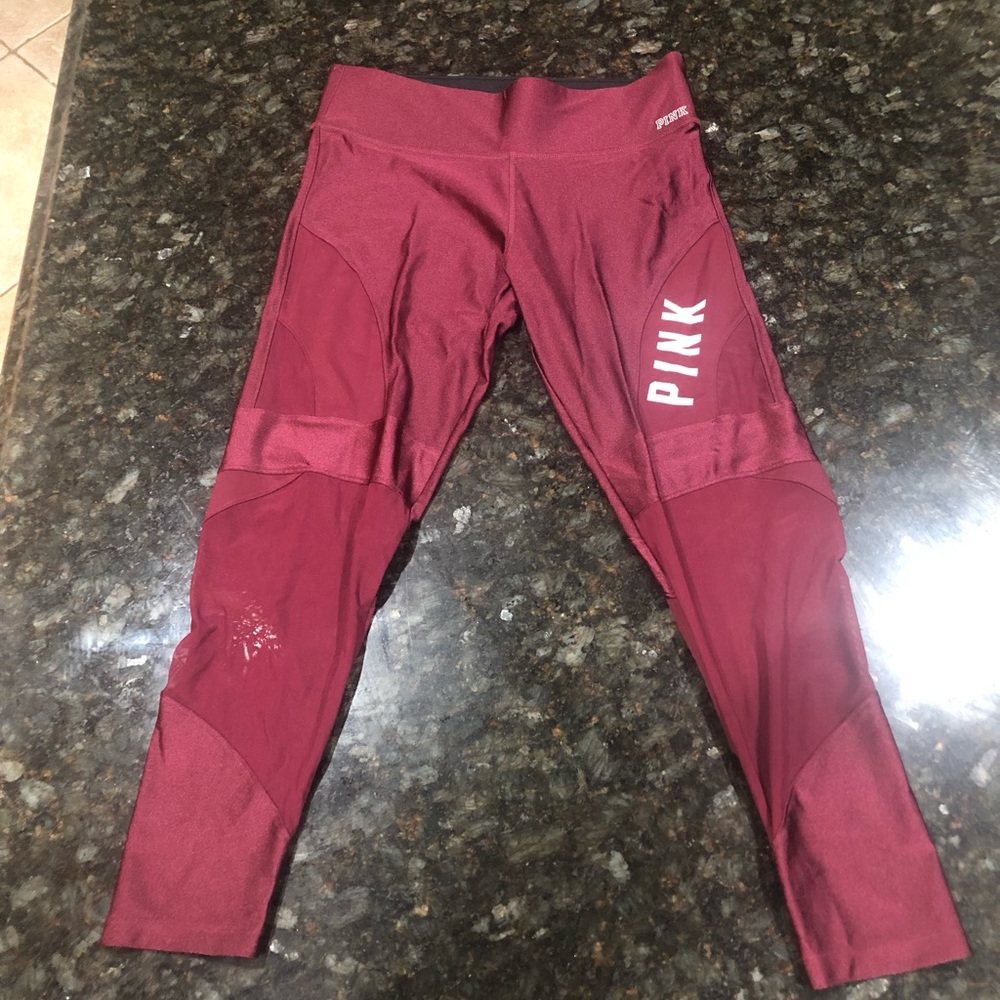 Pink Victoria’s Secret brand burgundy ultimate leggings.